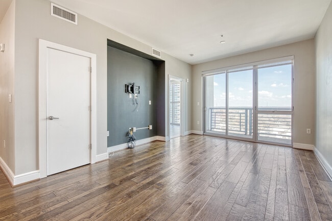 Living space with floor to ceiling windows - 333 W Trade St Unit 1501