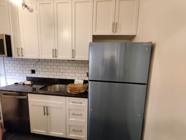 Photo - No Brokers Fee, No Security Deposit, Steps from the T Stop, Heat, Hot Water Included, Laundry is ...