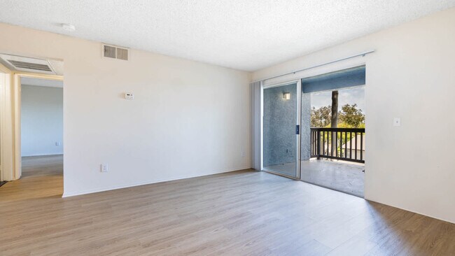 Living Room with Balcony and Hard Surface Flooring