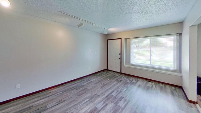Photo - Clean three bedroom one bath duplex with walk out basement with yard looking at trees, across fro...