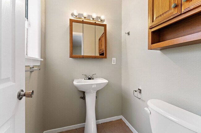 Photo - Beautifully remodeled 4 bedroom bath and a half with ceramic tile through out and laminate floori...