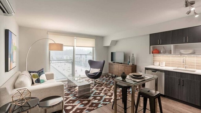 Luxury vinyl plank and floor-to-ceiling windows with solar shades in South Building apartments