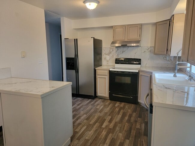 Photo - Spacious Spanaway rambler with covered patio and fenced yard.