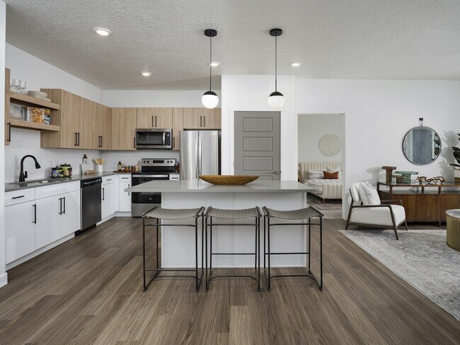 Kitchen with Island and Energy Efficient Appliances - Parc Ridge Apartments