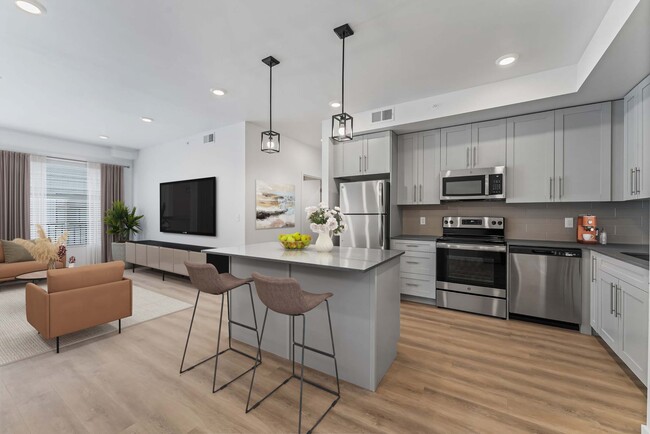 Kitchen/Living - The Residences at Victory Ranch Apartments