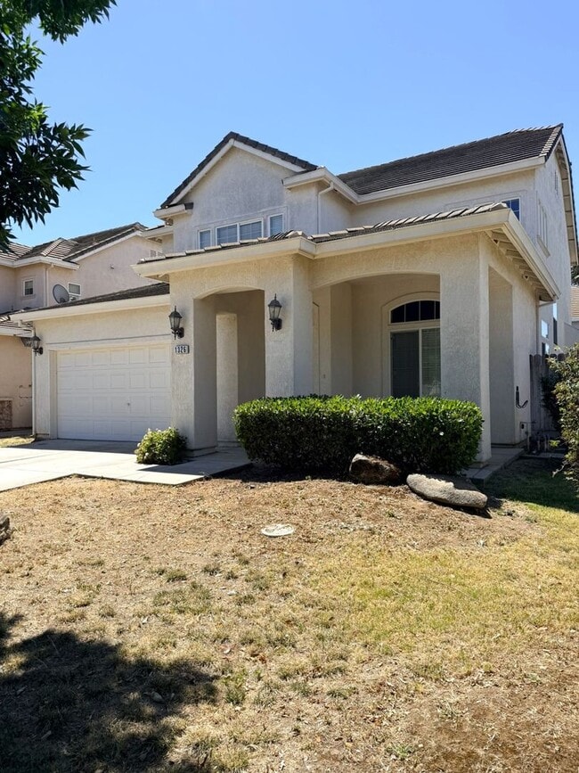 Photo - A must see 4/3 with a bedroom downstairs for convenience.
