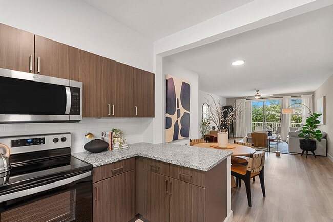 Beautifully upgraded kitchens with stainless steel appliances - The Timbers at Issaquah Ridge Apartments