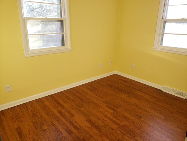 smaller back bedroom with hardwd, much light - 6452 Washington Ave Unit 6452