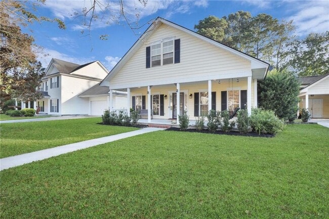 Photo - 4-Bedroom Home in Wild Heron with Front Porch and Fenced Yard