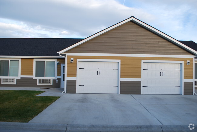 Exterior with attached garage included in rent - Wheatbaker Patio Home Apartments