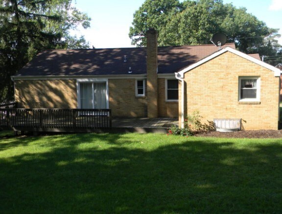 Back of house with deck - 8274 Elaine Dr