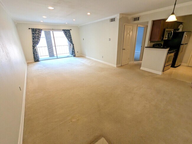 Large and spacious living and dining room with recessed lighting - 7555 Katy Freeway Unit 158