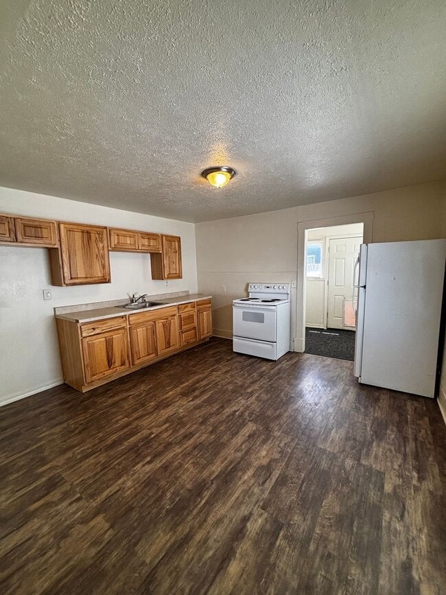 Photo - Quaint home with fully fenced yard and updates