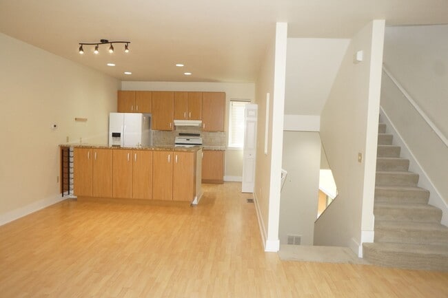 Photo - Beautiful 2 bedroom Belmont Condo. 3 Stories, 1 car garage, open floor plan, a/c. Amazing unit!