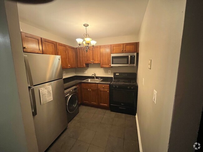 Building Photo - NEWLY AVAILABLE - RENOVATED 2 BR Unit 101 Rental