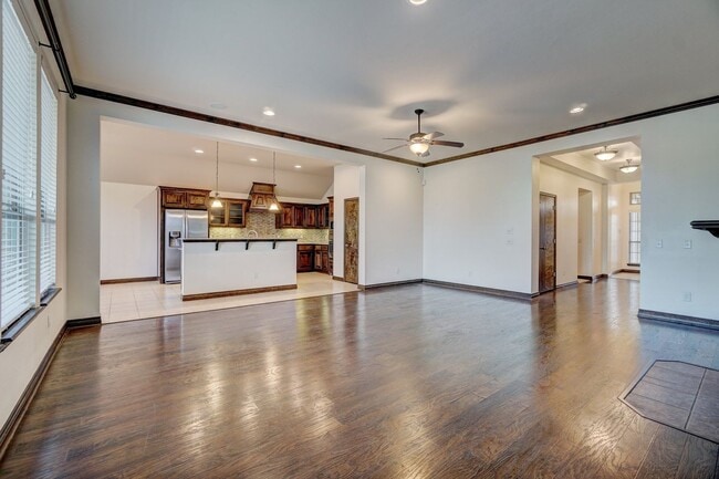 Photo - Stunning 4-Bedroom Home with Fireplace, Island Kitchen, 3-Car Garage & Large Backyard!