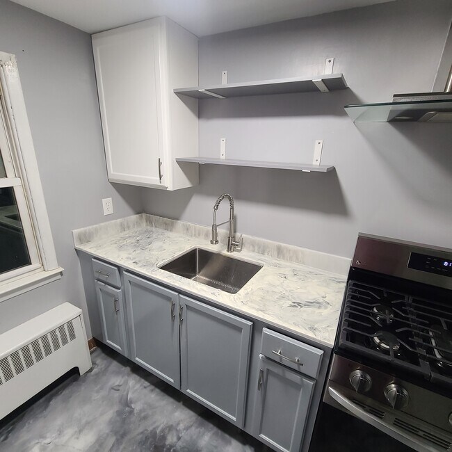 Kitchen sink and stove - 236 2nd Ave Unit B