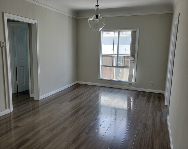 Living Room with Air Conditioer - 851 Sanborn Ave Apartments Unit 28