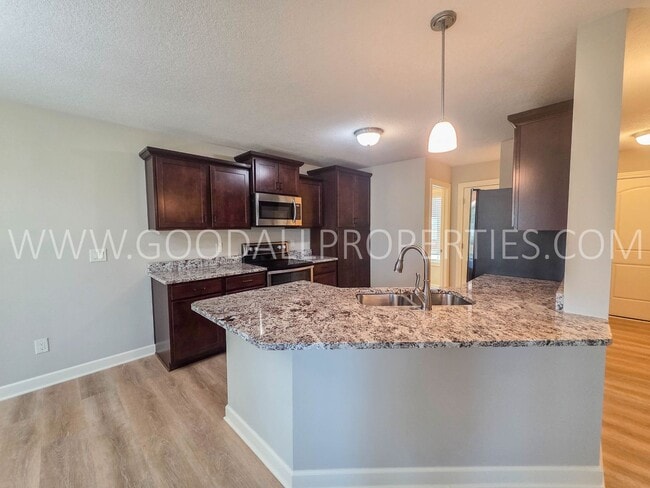 Photo - 4 Bed Waukee Home with Granite Counters & Covered Deck