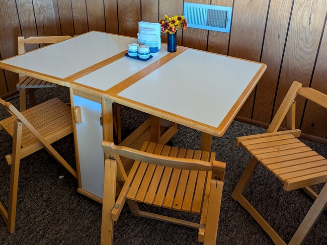 Dining table and chairs - 26180 Whispering Oak Ln Unit Talahi Studio