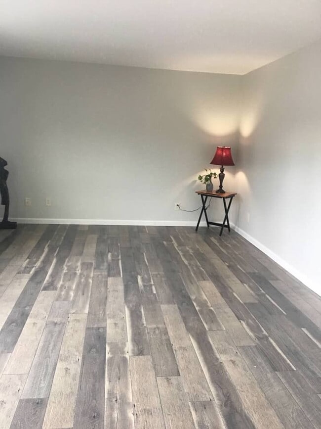 Large living room with vinyl plank floors - 924 Shorewood Dr Unit F