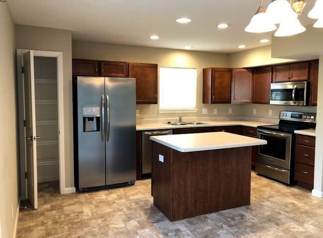 Photo - Spacious 4-Bedroom Home with Loft, Fenced Backyard & Modern Finishes