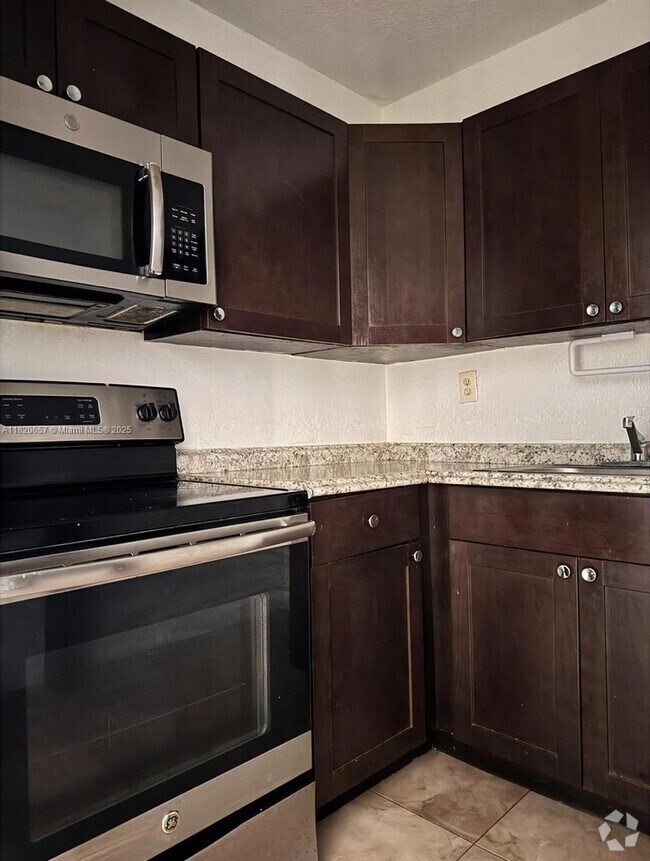 Building Photo - 8009 W 6th Ave Unit L Rental
