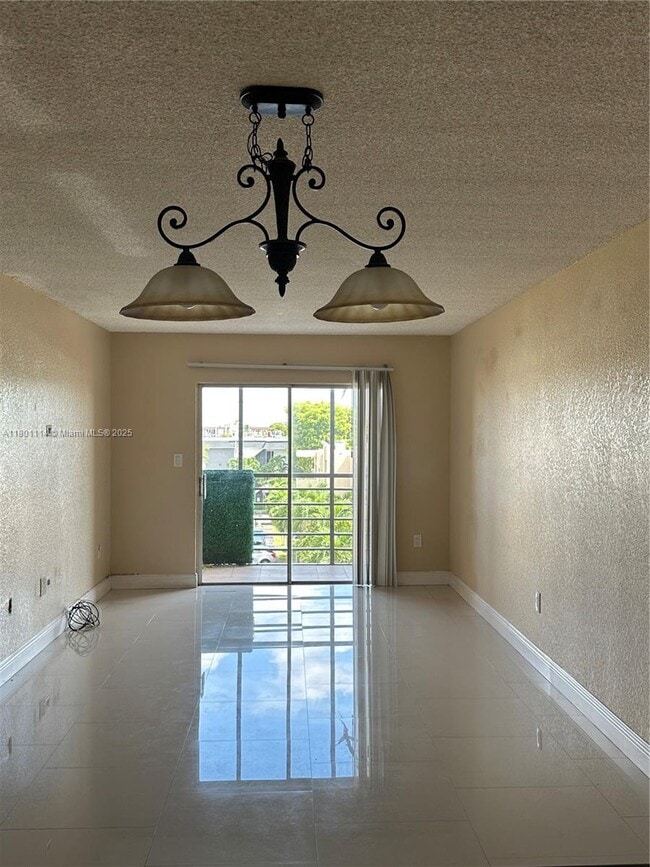 Building Photo - 6095 W 19th Ave Unit 407 Rental