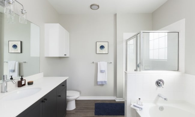 Separate shower stall with glass enclosure