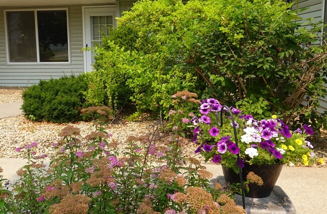 Surrounded by plantings & trees - 1610 Helena Rd N