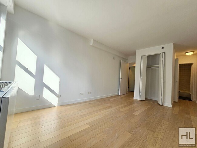 High-Floor One-Bedroom with 1.5 Baths and In-Unit Laundry Near the UN