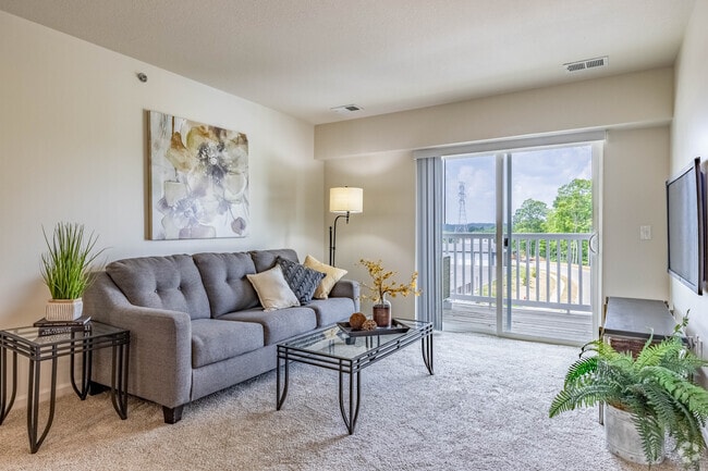 2BR, 1BA - 825SF - Living Room - Fieldchase Senior Apartments