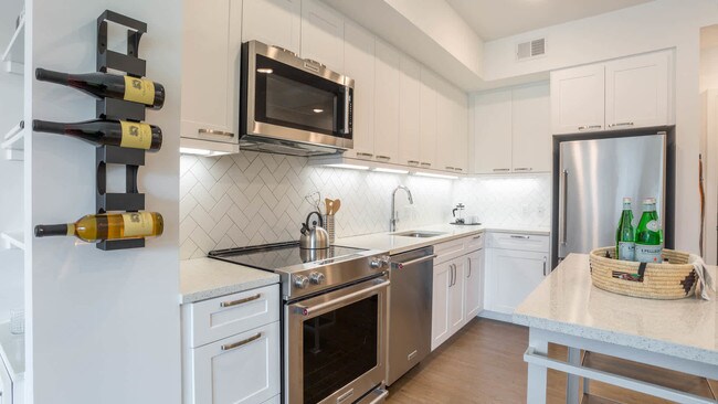 Kitchen with Stainless Steel Appliances and Quartz Countertops