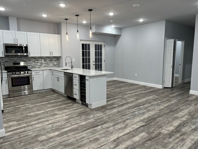 Kitchen, Dining, Living Area with Full Balcony - 1237 Lancaster Ave Unit Mezzanine One