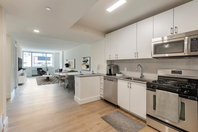 Renovated II North/South kitchen and living room with hard surface flooring - Avalon Clinton