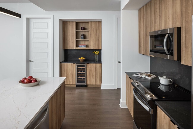 Custom built-in kitchen bars featuring drink refrigerators