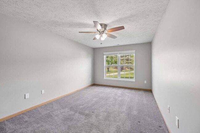 A spacious bedroom with soft natural light and a peaceful atmosphere offers the perfect place to relax and recharge.