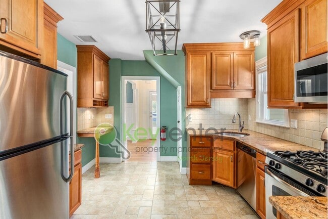 Photo - Spacious 4-Bedroom Home with Fenced Yard &...