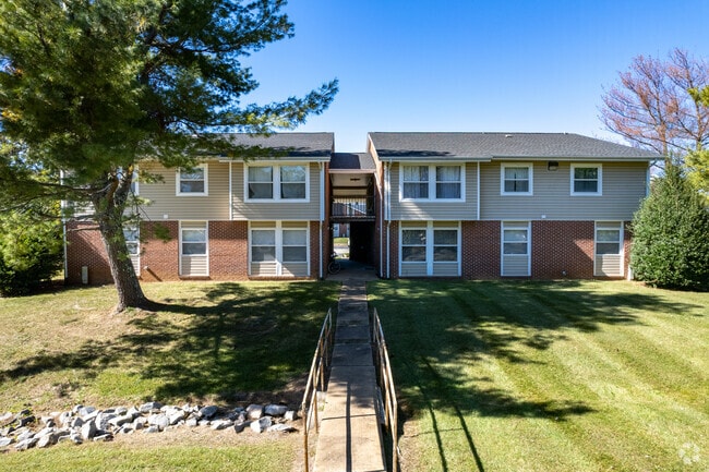 Walkway Leading to Apartment Building - Heritage Acres Apartments