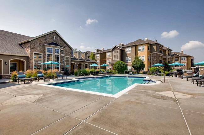 Cool off with a refreshing swim steps from home. - Grove at Cherry Creek Park