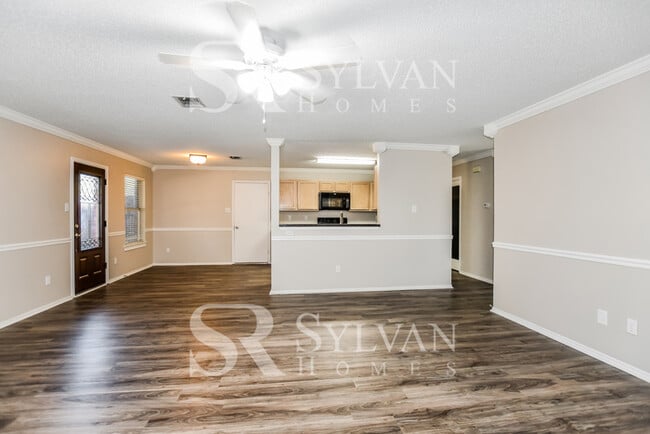 Photo - The living is easy in this gorgeous 4BR, 2.5BA brick home