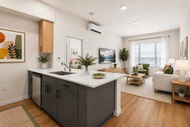 Open-concept 2-bedroom apartment with quartz countertops, modern finishes, and spacious living areas at 27 West Apartments.