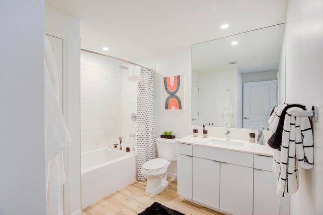 East Phase Bath with white cabinetry, white countertop, and hard surface flooring