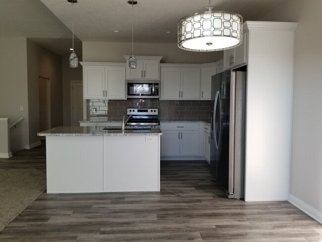 Photo - Daylight ranch townhome with 2 stall garage.  Private driveway and covered deck. high end finishe...