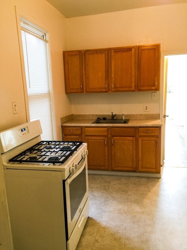 Photo - 2BR/1BA Single Family House with basement work-space and big yard!