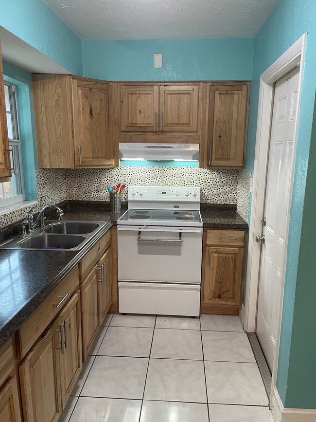 kitchen to garage - 6449 101st Way N House