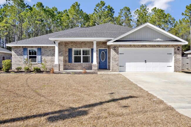 Building Photo - Like-New Navarre Rental with Private Fenced Yard, Modern Finishes, and Washer & Dryer Included