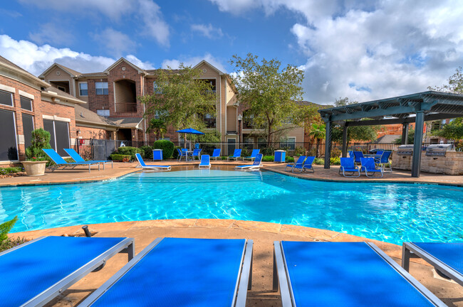 Pool with plenty of seating - Heritage At Hooper Hill Apartments