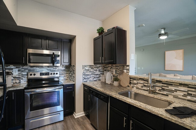 Oxmoor_2026_Kitchen_VirtuallyStaged - Oxmoor Apartments