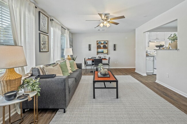 Contemporary Living Room with Wood-Style Flooring and Ceiling Fan
